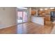 Bright kitchen featuring wood cabinets, granite countertops, stainless steel appliances, and access to an outdoor patio at 8641 Coors St, Arvada, CO 80005