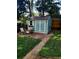 Charming backyard shed with ample seating area perfect for relaxing and enjoying the outdoors at 6649 Van Gordon Ct, Arvada, CO 80004