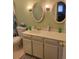 This bathroom features a dual vanity providing ample space and storage at 6649 Van Gordon Ct, Arvada, CO 80004