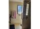 Modern bathroom with tiled shower featuring grab bars and glass block window for natural light at 6649 Van Gordon Ct, Arvada, CO 80004