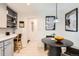 Eat-in kitchen features a breakfast nook and updated cabinetry at 845 Everett St, Lakewood, CO 80215