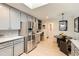 Updated kitchen boasts modern appliances, gray cabinetry, and an adjacent eat-in area at 845 Everett St, Lakewood, CO 80215