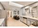 Bright kitchen with skylight, stainless steel appliances, and modern countertops at 845 Everett St, Lakewood, CO 80215