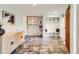 Stylish mud room with tiled floors, a built-in bench and storage, and modern decor at 845 Everett St, Lakewood, CO 80215