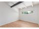 Bright room with light hardwood floors and good light from window at 1570 S Chase St, Lakewood, CO 80232
