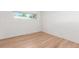 Bright room with light hardwood floors and good light from window at 1570 S Chase St, Lakewood, CO 80232