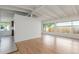 Bright, open living room with hardwood floors and large windows offering natural light at 1570 S Chase St, Lakewood, CO 80232