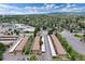 Scenic aerial view of townhomes with convenient parking and mature trees amidst a lush green landscape and mountain backdrop at 13043 W 20Th Ave, Golden, CO 80401