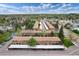 Aerial view of the community, emphasizing the layout of the buildings, parking, and trees at 13043 W 20Th Ave, Golden, CO 80401