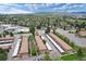 Lovely aerial view of townhomes, lots of green space, convenient parking, and mature trees, with mountains in the background at 13043 W 20Th Ave, Golden, CO 80401
