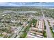 Aerial view capturing townhomes situated within a green landscape near a lake and surrounding residential neighborhood at 13043 W 20Th Ave, Golden, CO 80401
