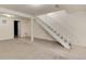 Spacious finished basement with staircase and neutral carpeting offers flexible living space at 13043 W 20Th Ave, Golden, CO 80401