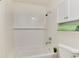 Clean bathroom featuring a white tiled bathtub and shower, offering a fresh space at 13043 W 20Th Ave, Golden, CO 80401