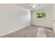 Bright bedroom with a large window overlooking greenery and neutral carpeting at 13043 W 20Th Ave, Golden, CO 80401