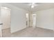 Bedroom featuring neutral carpet, white walls, and access to a bathroom and closet at 13043 W 20Th Ave, Golden, CO 80401
