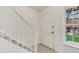 Bright entryway features clean white walls and staircase, with tile and carpet flooring at 13043 W 20Th Ave, Golden, CO 80401