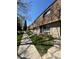 Charming brick townhomes featuring well-maintained landscaping and inviting pathways at 13043 W 20Th Ave, Golden, CO 80401