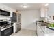 Updated kitchen with stainless appliances, granite countertops and ample white cabinetry at 13043 W 20Th Ave, Golden, CO 80401