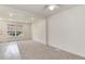 Spacious living area featuring new carpet, a window, and fresh white walls at 13043 W 20Th Ave, Golden, CO 80401