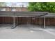 Carport parking area with designated spaces and a metal canopy overhead at 13043 W 20Th Ave, Golden, CO 80401