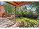 Inviting backyard featuring a shaded patio area and lush greenery providing a private and serene outdoor space at 11112 Dahlia Way, Thornton, CO 80233