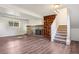 Finished basement featuring a fireplace, built-in shelving, and stair access, ideal for a Gathering room at 11112 Dahlia Way, Thornton, CO 80233
