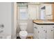 Bathroom featuring a toilet and tile trimmed vanity at 11112 Dahlia Way, Thornton, CO 80233