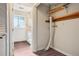 Bright bathroom with a window, white vanity, and wood-look flooring at 11112 Dahlia Way, Thornton, CO 80233