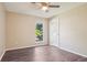 Neutral bedroom featuring a ceiling fan, window, and a modern flooring at 11112 Dahlia Way, Thornton, CO 80233