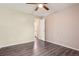Bright bedroom featuring ceiling fan, and a view into an adjoining bathroom at 11112 Dahlia Way, Thornton, CO 80233