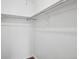 White walk-in closet with wooden look flooring at 11112 Dahlia Way, Thornton, CO 80233