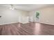 Open loft featuring a ceiling fan and staircase with white railing at 11112 Dahlia Way, Thornton, CO 80233