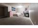 Finished basement with bed, desk and pink dresser at 1359 S Chambers Cir # C, Aurora, CO 80012