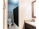 Bathroom featuring a toilet, shower with curtain, vanity and mirror at 1359 S Chambers Cir # C, Aurora, CO 80012