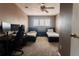 Bedroom featuring two twin beds, a ceiling fan and large window with natural light at 1359 S Chambers Cir # C, Aurora, CO 80012