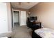 Bedroom featuring two twin beds and an open doorway to another room at 1359 S Chambers Cir # C, Aurora, CO 80012