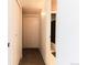 Hallway with carpet leading to a bathroom with shower at 1359 S Chambers Cir # C, Aurora, CO 80012