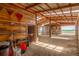Well-equipped barn interior with stalls and storage, optimized for livestock care and farming at 46303 E 106Th Ave, Bennett, CO 80102