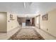 Open basement area featuring tile floors, a staircase, and entertainment center at 46303 E 106Th Ave, Bennett, CO 80102