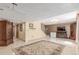 Finished basement area with entertainment setup, tile flooring and access to stairs at 46303 E 106Th Ave, Bennett, CO 80102