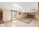 Basement area featuring tile floors, a wet bar, and abundant natural light at 46303 E 106Th Ave, Bennett, CO 80102