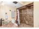 Well-maintained bathroom with shower, glass sink, and horseshoe decorations at 46303 E 106Th Ave, Bennett, CO 80102