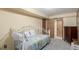 Cozy bedroom featuring a daybed with ornate metal frame and comfortable quilt at 46303 E 106Th Ave, Bennett, CO 80102