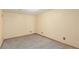 Neutral-toned room with carpet flooring and standard electrical outlets at 46303 E 106Th Ave, Bennett, CO 80102