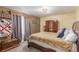 Cozy bedroom with a bed, vintage wooden furniture, and carpeted floor at 46303 E 106Th Ave, Bennett, CO 80102