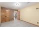 Empty bedroom featuring light walls, carpeted floor and a closet at 46303 E 106Th Ave, Bennett, CO 80102