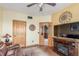 Cozy living area with a comfortable sofa, fireplace, and ample natural light at 46303 E 106Th Ave, Bennett, CO 80102