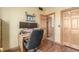 Office space featuring wood floors and two closets for storage and organization at 46303 E 106Th Ave, Bennett, CO 80102