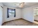 Serene bedroom with neutral walls, cozy carpeting, and an attached bathroom at 11321 Mesa Verde Pl, Parker, CO 80138