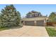 Charming two-story home featuring a three car garage and beautiful mature trees at 11321 Mesa Verde Pl, Parker, CO 80138
